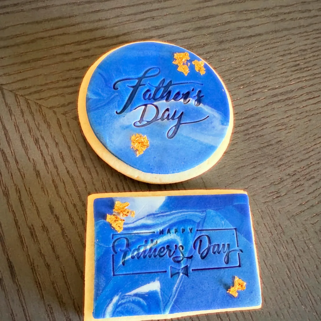 Round and rectangle Father's Day cookies hand-painted in blue watercolor with gold leaf