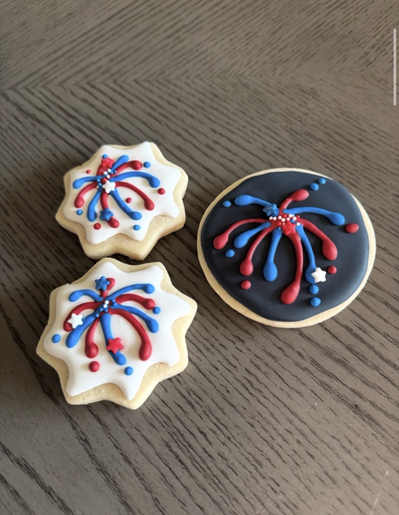 Patriotic 4th of July decorated sugar cookies with red, white and blue fireworks royal icing
